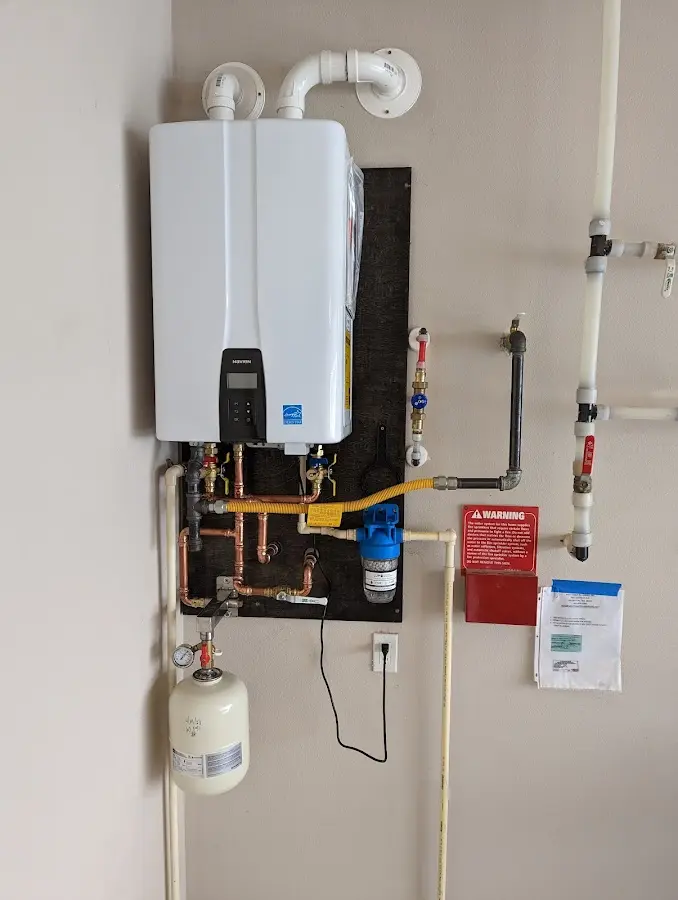 Professional plumber installing copper piping in a Punxsutawney home